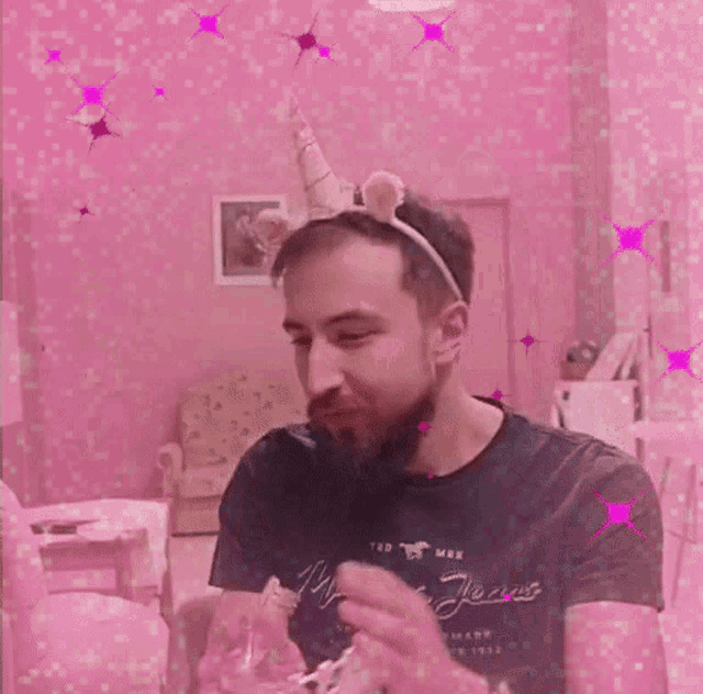 a man wearing a unicorn headband and a shirt that says mustang jean