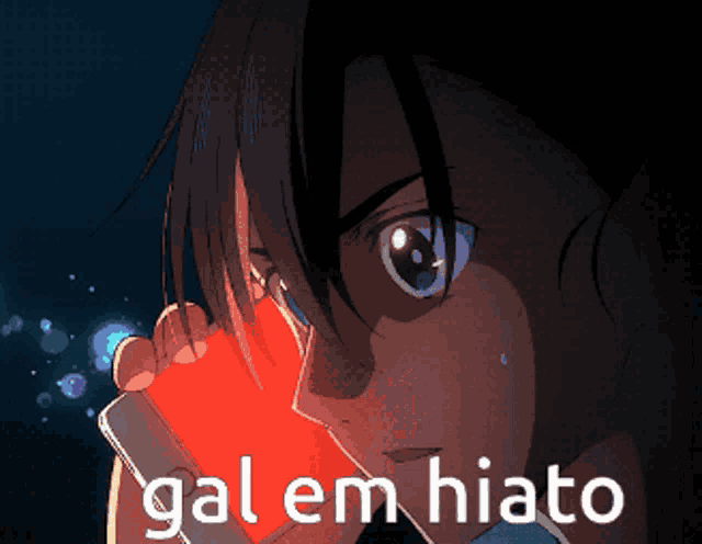 a person holding a cell phone with the words gal em hiato on the bottom right