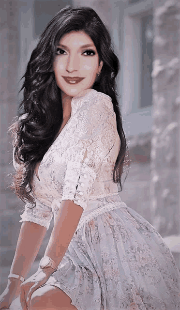 a woman wearing a white dress and a watch