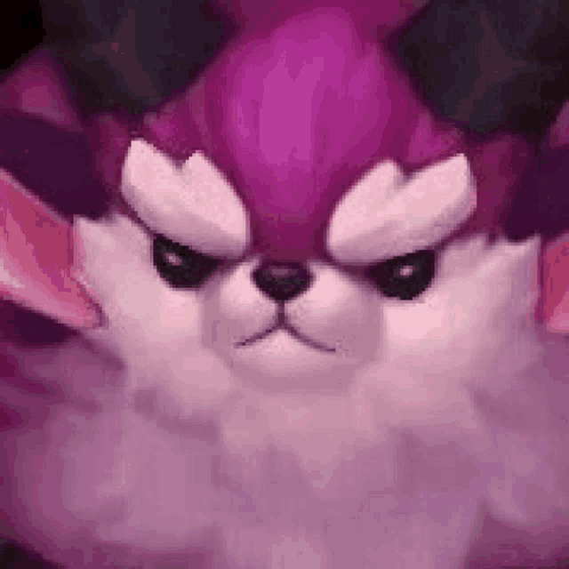 a close up of a purple and white rabbit with horns .