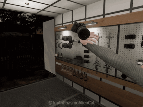 a person is holding a camera in front of a wall with crosses