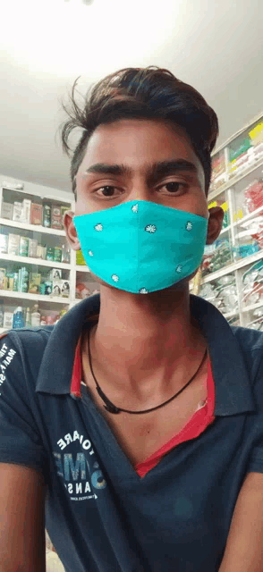 a man wearing a blue face mask is wearing a shirt that says emc