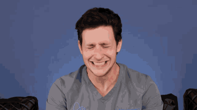 a man wearing a scrub top that says dr. on the front