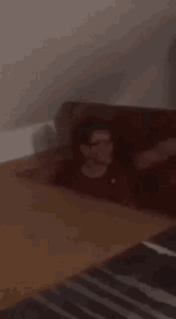 a blurry picture of a man in a box with the words klobasky tam mam on the bottom