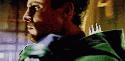 a man in a green jacket has a crown on his back