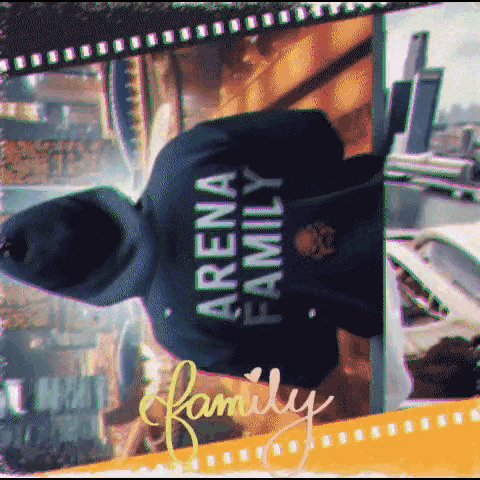 a person wearing a hoodie that says arena family on it