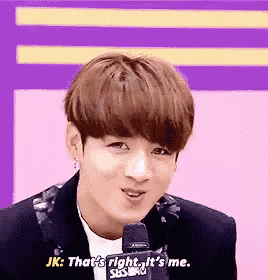 a young man is talking into a microphone and says jk that 's right , it 's me .