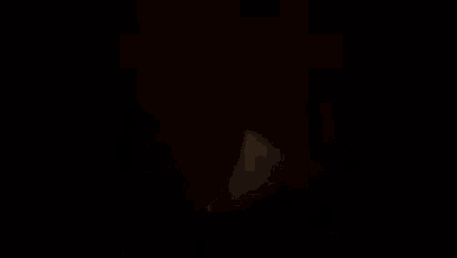 a close up of a person 's face with a slight smile on it