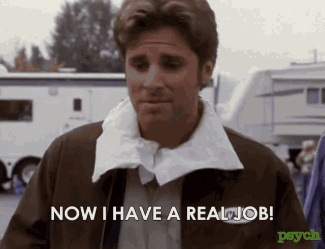 a man in a brown jacket is saying now i have a real job