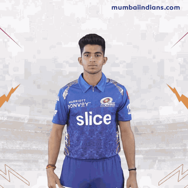 a young man wearing a blue shirt that says slice