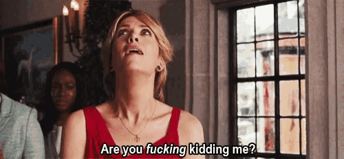 a woman in a red dress is saying are you fucking kidding me .