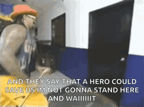 a man is standing in a hallway with a sign that says and they say that a hero could save us