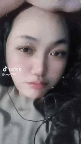 a close up of a woman 's face with a tiktok watermark on it