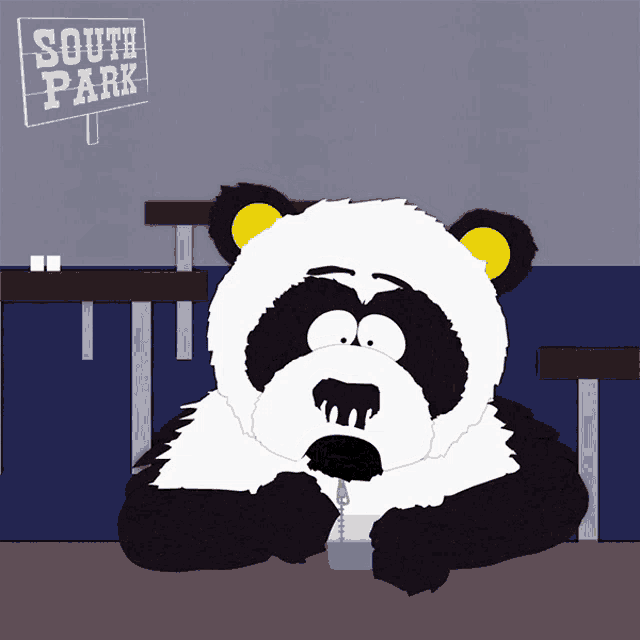 a panda bear sits at a table with a sign above it that says south park