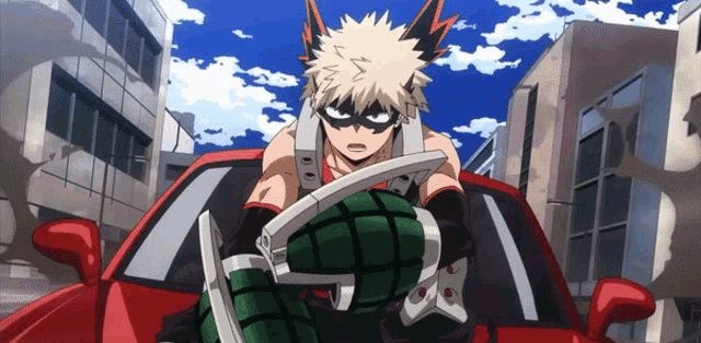 a man in a mask is sitting in a red car holding a grenade