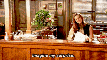 a woman sits at a counter with the words imagine my surprise written on it