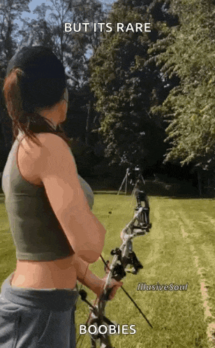 a woman is holding a bow and arrow .