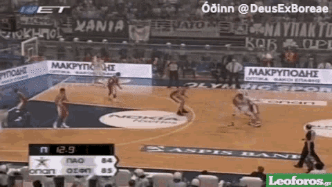 a basketball game is being played in a stadium and the score is 12-9