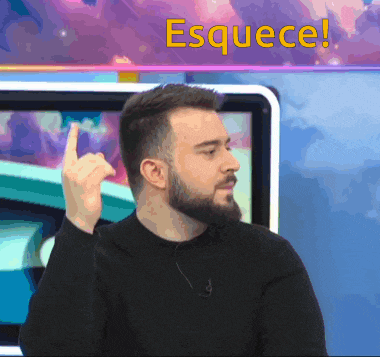 a man with a beard holds up his finger in front of a screen that says esquece