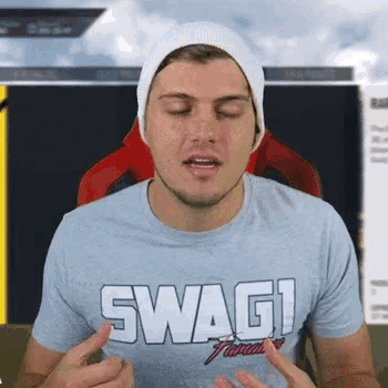 a man wearing a hat and a t-shirt that says swag .