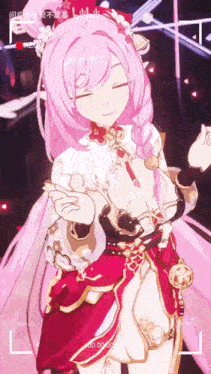 a video of a girl with pink hair is being recorded on a camera