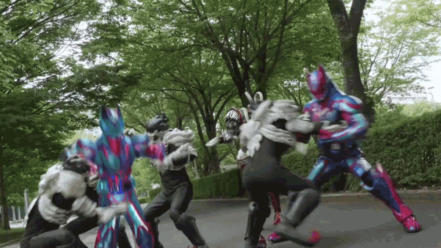 a group of superheros are fighting each other on the street