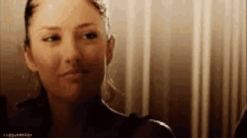 a close up of a woman 's face with the word rugged on the bottom right corner