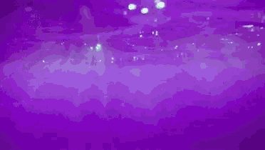 a purple background with a green light shining on it