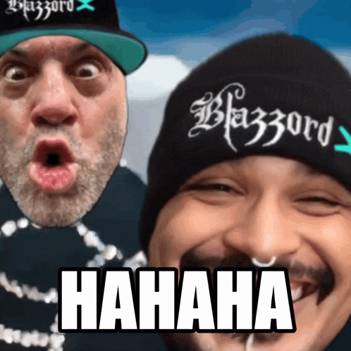 two men are posing for a picture and one of them is wearing a hat that says blazzard