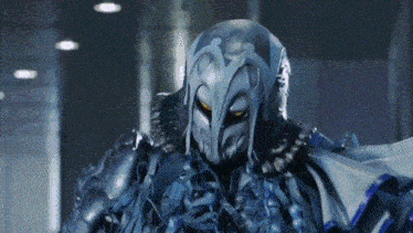a close up of a person wearing a helmet and armor