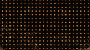 a target is surrounded by a grid of dots on a dark background