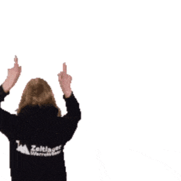 a woman in a zeltinger warehouse shirt holds her hands up
