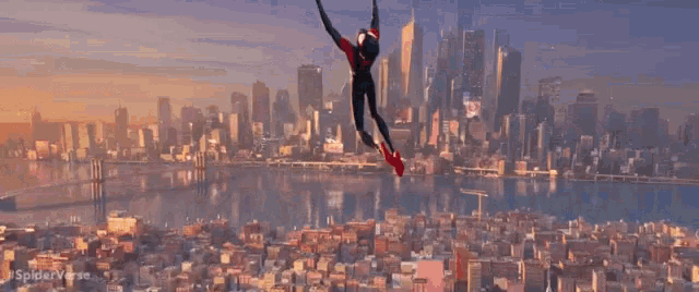 a man in a spiderman costume is flying over a city .