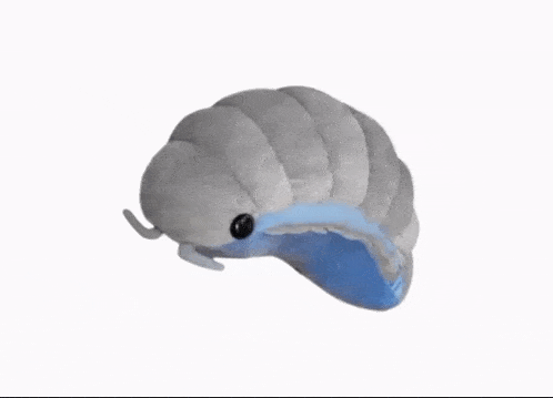 a stuffed animal that looks like a slug with a blue tail