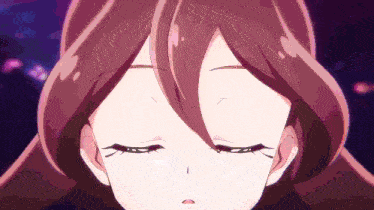 a close up of a girl 's face with closed eyes