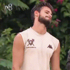a man with a beard is wearing a white kappa tank top
