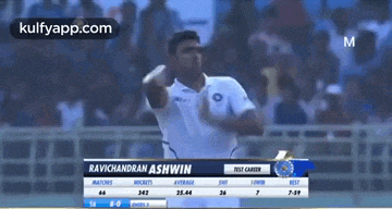 ravichandran ashwin is throwing a ball during a cricket game