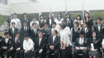 a large group of people are posing for a picture