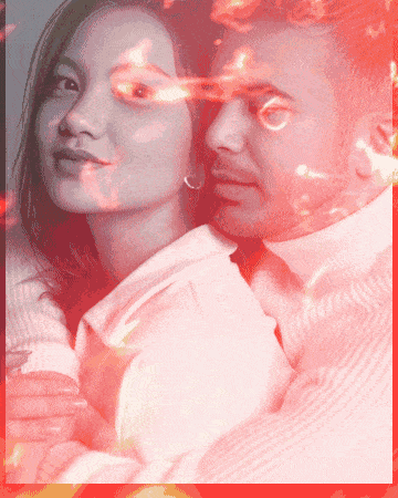 a man and a woman are hugging each other