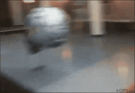 a close up of a person spinning a ball on a table with a 4gifs.com logo in the corner .