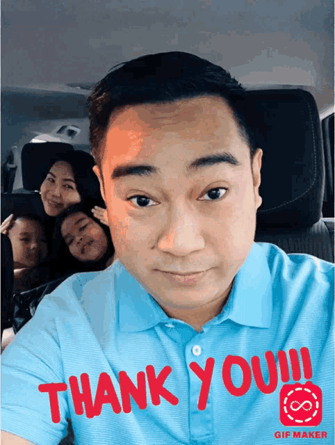 a man in a blue shirt with the words thank you on it