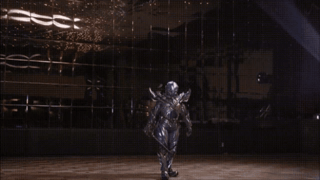 a person with wings and a sword in their hand