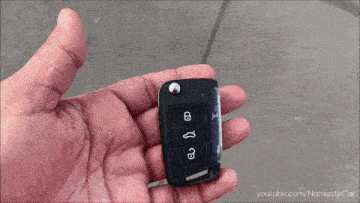 a person is holding a car key in their hand with youtube.com/namastecar written on the bottom