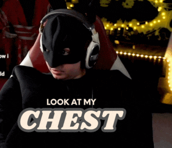 a man wearing a mask and headphones says " look at my chest "