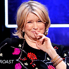 a woman wearing a black sweater that says roast