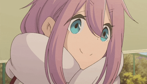 a girl with purple hair is smiling with her hands on her face
