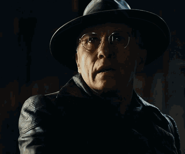 a man wearing a hat and glasses says " it 's a trap "