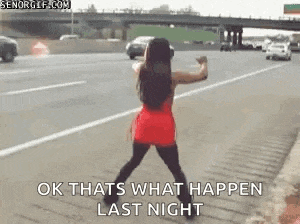 a woman in a red dress is dancing on a highway .