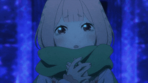 a girl with a scarf around her neck looks at the camera with a surprised look on her face