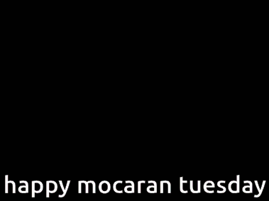 a billboard says happy mocaran tuesday with a picture of a girl on it